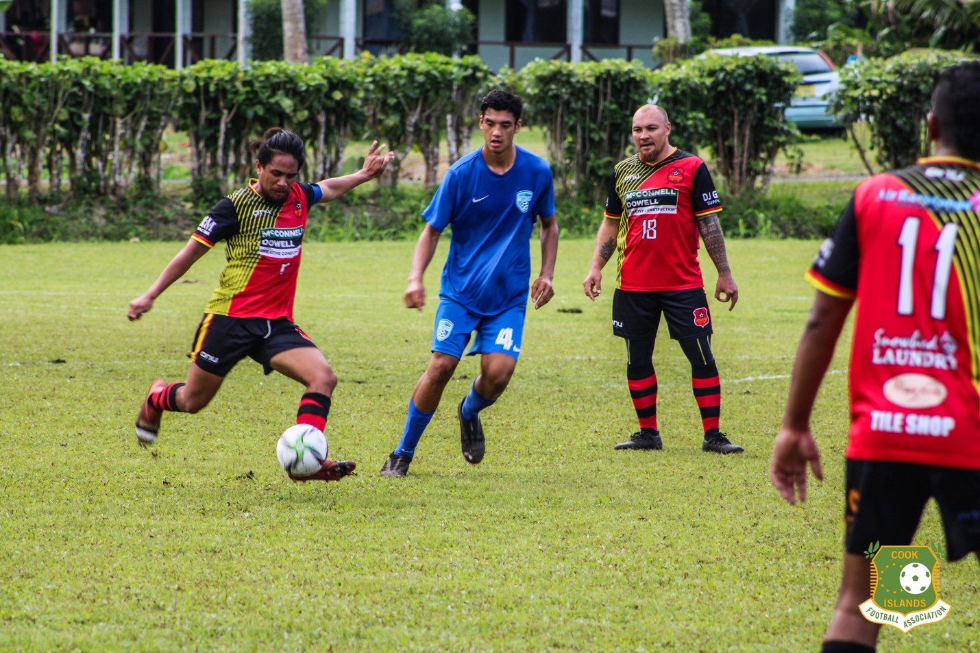 Puaikura’s Jarves Aperau clears the ball away from Titikaveka’s Nuku Mokoroa